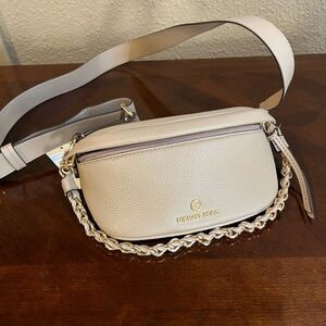 Brand new Michael Kors Slater XS sling pack messenger camel leather